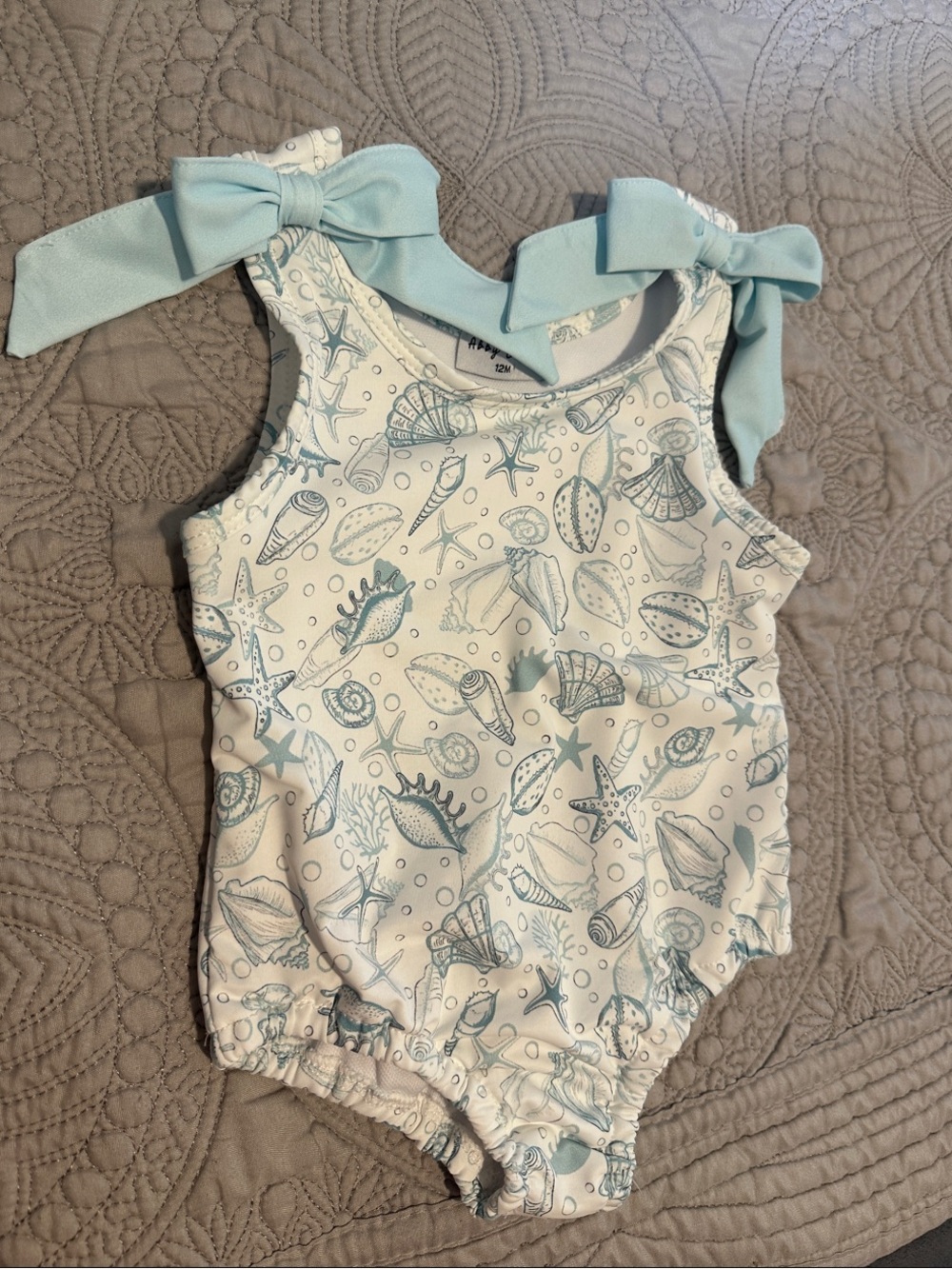 Girls' Sea Shell Print One-Piece with Light Blue Bow Straps